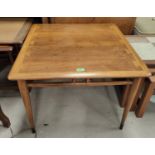 A 1960's teak coffee table with square top and 'revealed construction'