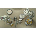 A selection of vintage 'AA' badges and other car badges etc