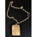 A 9 carat hallmarked gold rectangular locket with chased decoration, on rope twist chain stamped