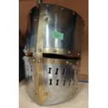 A full size replica steel Crusades style helmet, ht. 34cm