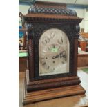 A late 19th century large impressive bracket clock in carved mahogany case with caddy top, chased