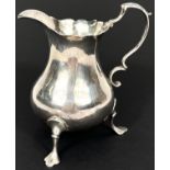 A mid Georgian silver cream jug of plain baluster form, London 1762, maker AN*1, 73gm