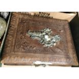 A 19th century French photograph album with embossed metal work to the front, brown leather, musical