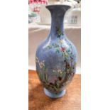 A Chinese border blue Chinese vase with polychrome decoration, scrolling incised detail, four