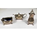 A hallmarked silver Georgian style 3 piece cruet of rounded rectangular form with gadrooned rims, on