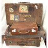 A vintage leather travel case, with travel stickers B.O.A.C etc, two smaller and another larger bag