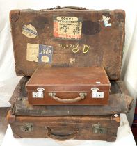 A vintage leather travel case, with travel stickers B.O.A.C etc, two smaller and another larger bag