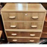 A 1950's walnut chest of drawers; a 1930's oak occasional table with drawer