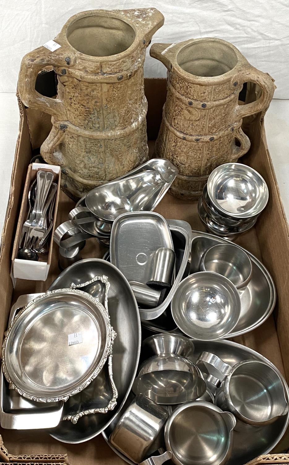 A large stoneware jug and a smaller one; a selection of stainless steel teaware