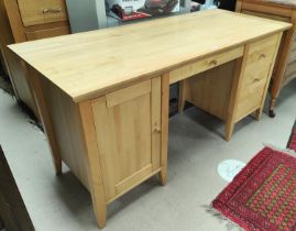 A modern lightwood kneehole desk with cupboard and 2 drawers