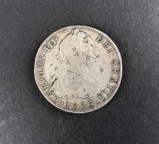 WORLD COINAGE: A 1776 Mexico Spanish Colony Carlos III 8 Reals silver coin bearing chop/counter