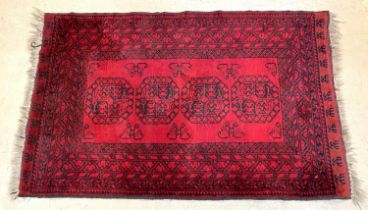 An Afghan rug 180 x 115cm