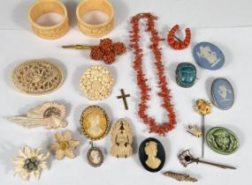 A selection of vintage costume jewellery:- Cameo brooches and pendant; carved bone brooches, a coral