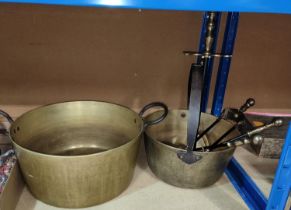 A large heavy brass doubled handled pan and another, and a30 fire companion