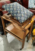 An oak 2 tier trolley/table; an adjustable gout stool with needlework upholstery