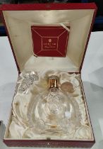 A Louis XIII Remy Martin bottle, cased in a red presentation case (empty).