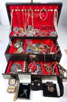 A selection of costume jewellery, brooches etc