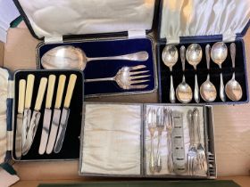 A selection of boxed cutlery and loose
