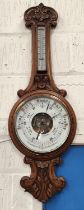 A Shearwater Lloyd of Liverpool Oak cased aneroid barometer carved case with open workings