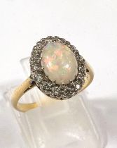 Gold, hallmark worn ring with opal (good quality) 9mm x 7mm, surrounded by 16 diamonds, 3.8gms, ring