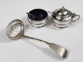 A hallmarked silver sieving ladle and two cruet pots, various assay 4.8oz