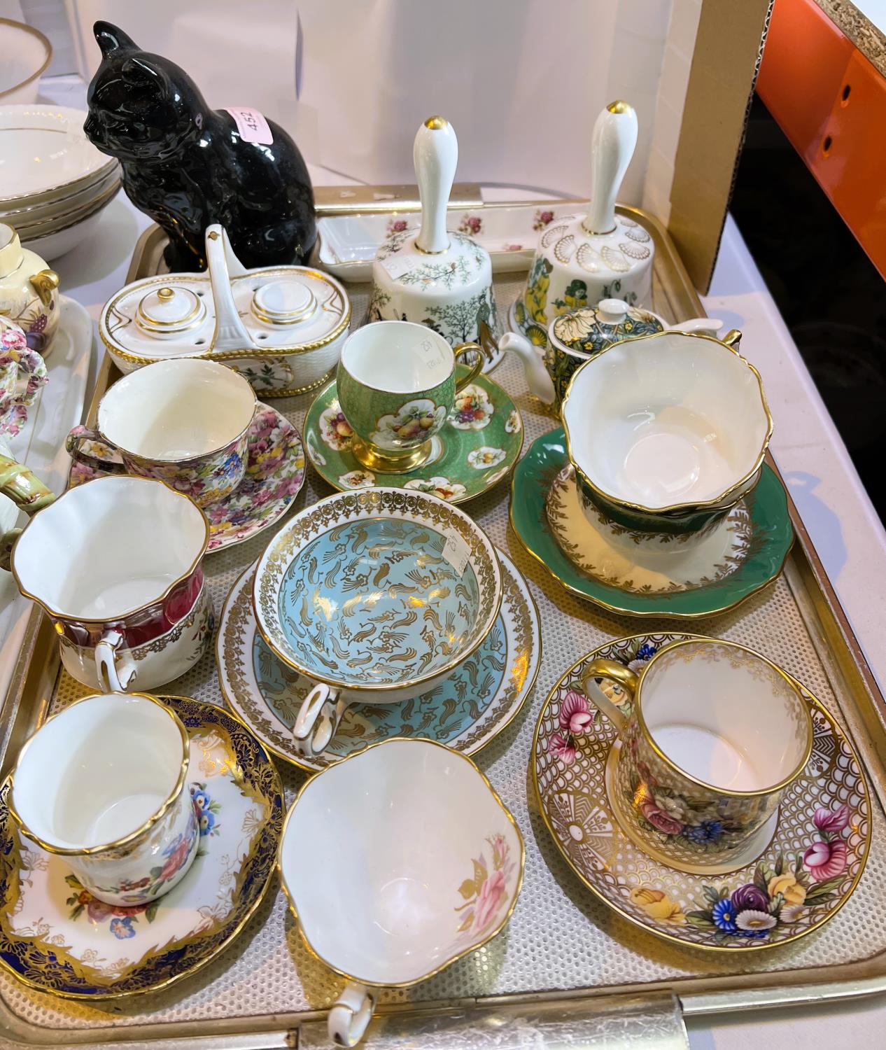 A selection of miniature and decorative china cups and saucers