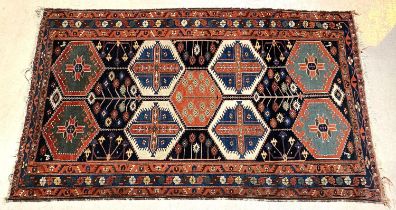 An antique Turkey rug, geometric motifs, 215 x 132cm