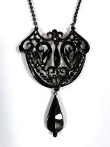A pretty 'heart shaped' pierced jet pendant with tear shape drop on integral chain, maximum width