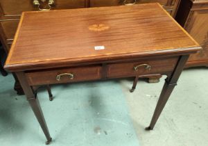 An inlaid mahogany card table with two draws, fold out top, square tapering legs.