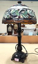 A Tiffany style lamp in bronze finish