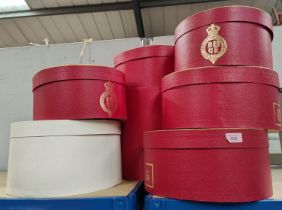 A selection of Vintage Red Christy's London hat boxes of various shapes and sizes with gilt armorial