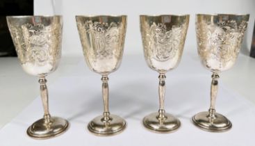 A hallmarked silver set of 4 goblets with gilt interiors and chased acanthus decoration, of tapering