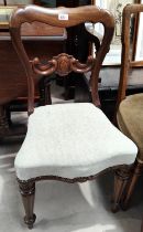 A mahogany carved bedroom chair shield to back reeded tapering legs and two other mahogany chairs.