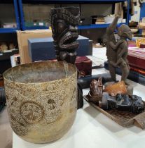 A collection of African carved wooden tribal figures and a brass Middle Eastern Bowl