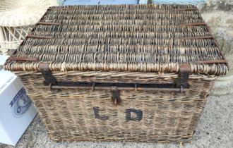 A large wicker hinge lidded travel basket