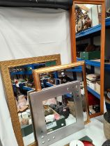 Three gilt framed wall mirrors and others