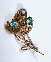 A 9 carat hallmarked gold spray brooch the triple stem set 3 blue topaz, 7gm