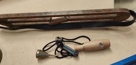 Three duck hunting whistles, one wood and one metal; a desk top magnifier by Hatters & Garnett and