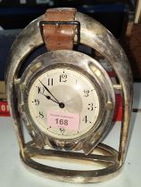 An Art Deco Silver plate horseshoe clock with Swiss movement