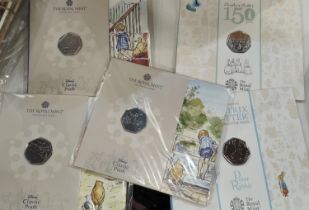 GB: Beatrix Potter 2 x 50p, Classic Pooh, 3 x 50p, in presentation packs