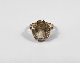 A 9ct gold dress ring with smoky coloured stone, 3.1gm