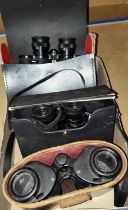 Three pairs of cased binoculars