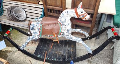 A Full size Victorian wooden bow base rocking horse with painted decoration and a large model flying