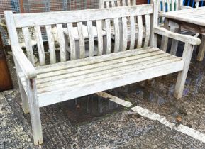 A teak garden bench and side table