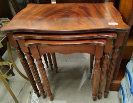 A nest of three reproduction inlaid mahogany occasional tables shaped rectangular form, reeded legs