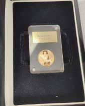 A slabbed 2016 Remembrance Coin 'Lest We Forget' Elizabeth II gold Sovereign in box