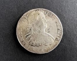 WORLD COINAGE: An 1811 Mexico Ferdinand VII with portrait of Carlos IV 8 Reals silver coin with