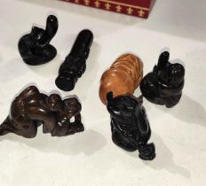 A selection of carved wooden netsuke.