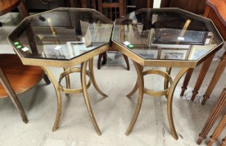 A pair of mid century continental bronze side tables, octagonal smoked glass tops, 37cm x 51 cm high