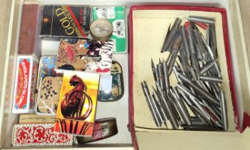 A box of collectables:  dip pen nibs; windup gramophone needles; vintage matchboxes; etc.